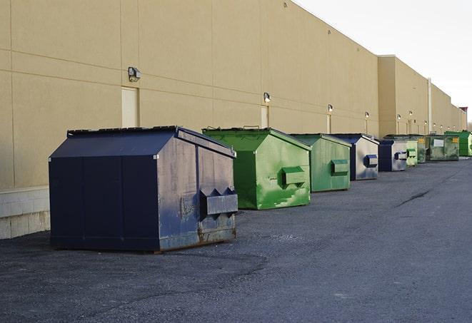 red and green waste bins at a building project in Cedar Lake